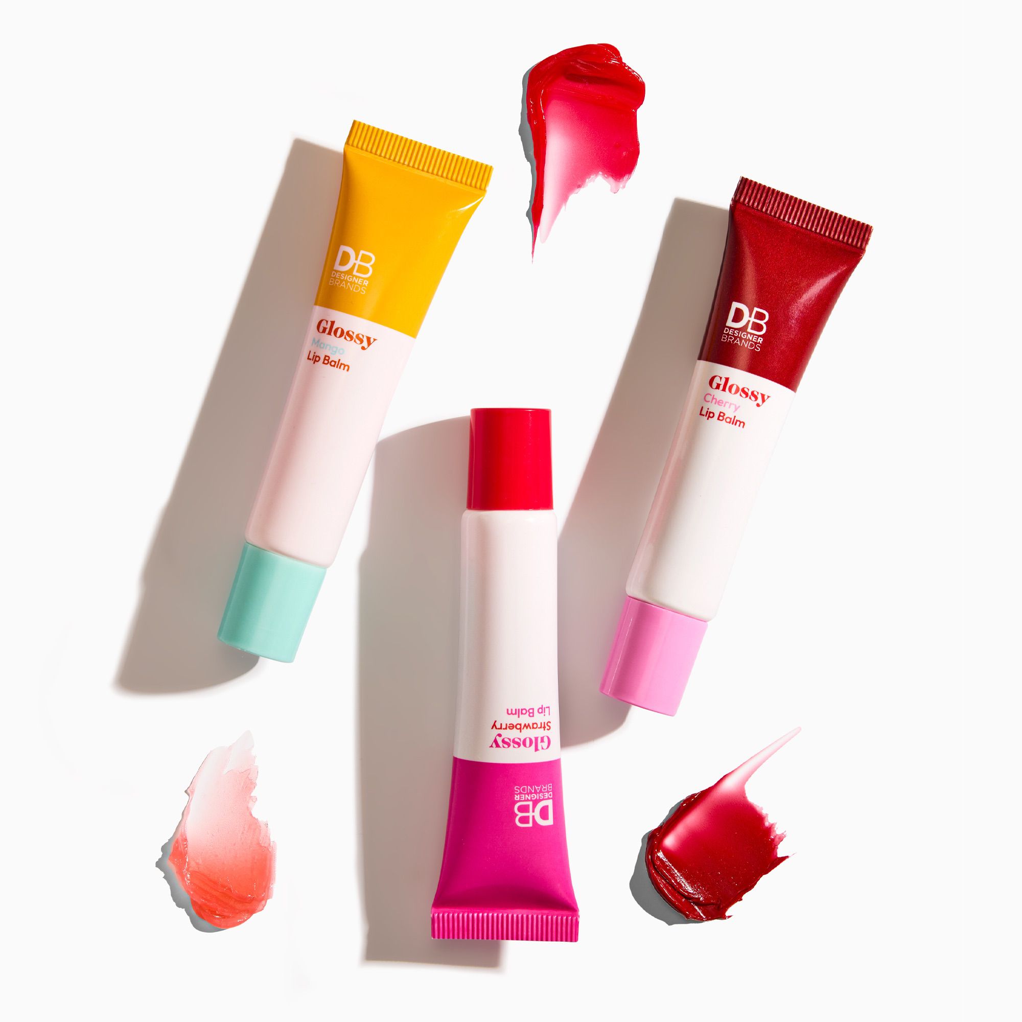 Colorful lip balm tubes with visible brand name on a white background