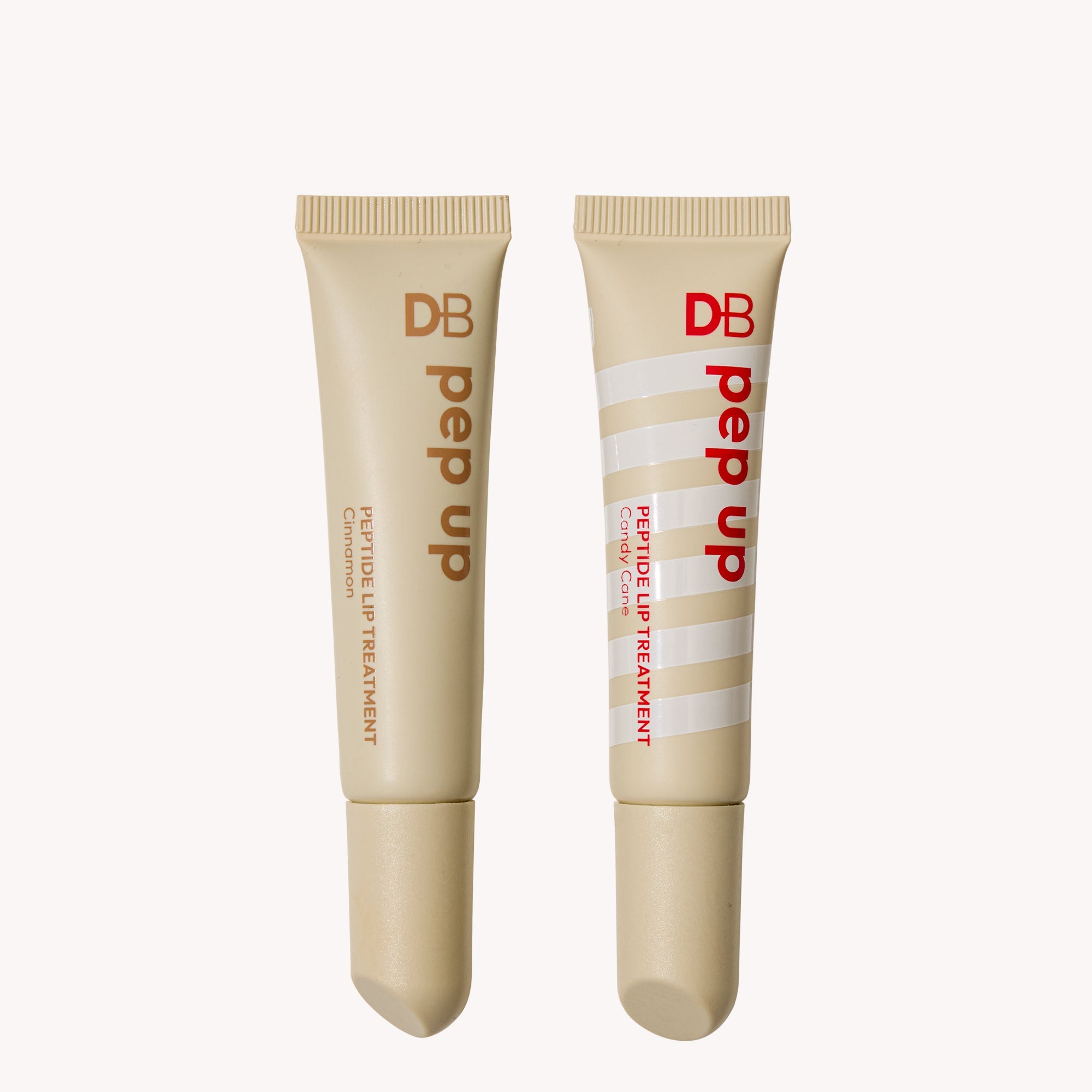 Two DB Pep Up lip treatment tubes on a white background