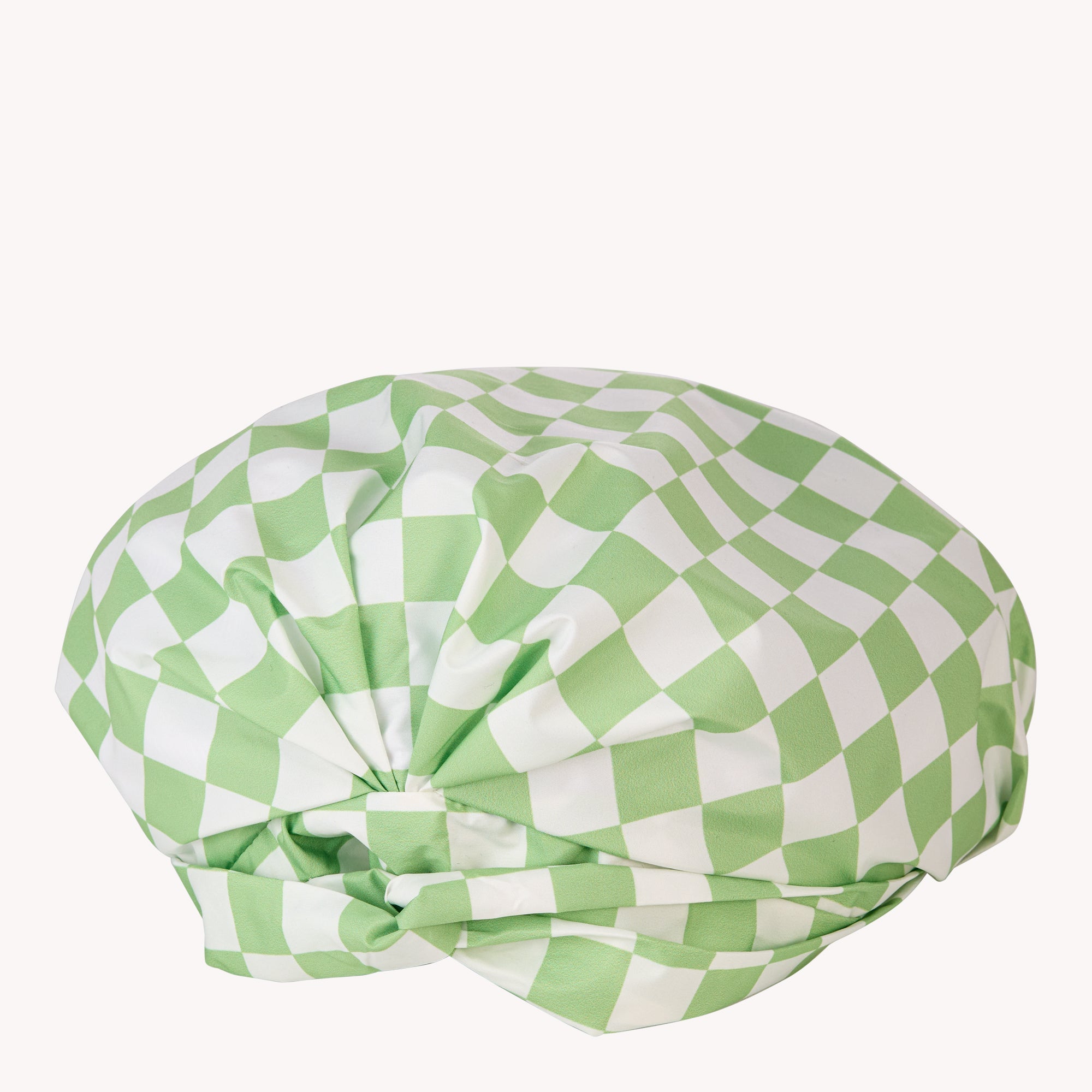 Green and white checkered fabric wrap, elegantly knotted, ideal for luxury jewellery packaging or high-end gift wrapping.