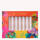 Colourful satin pillowcase packaging with striped pillowcase visible through a window. Vibrant floral and abstract patterns adorn the box.
