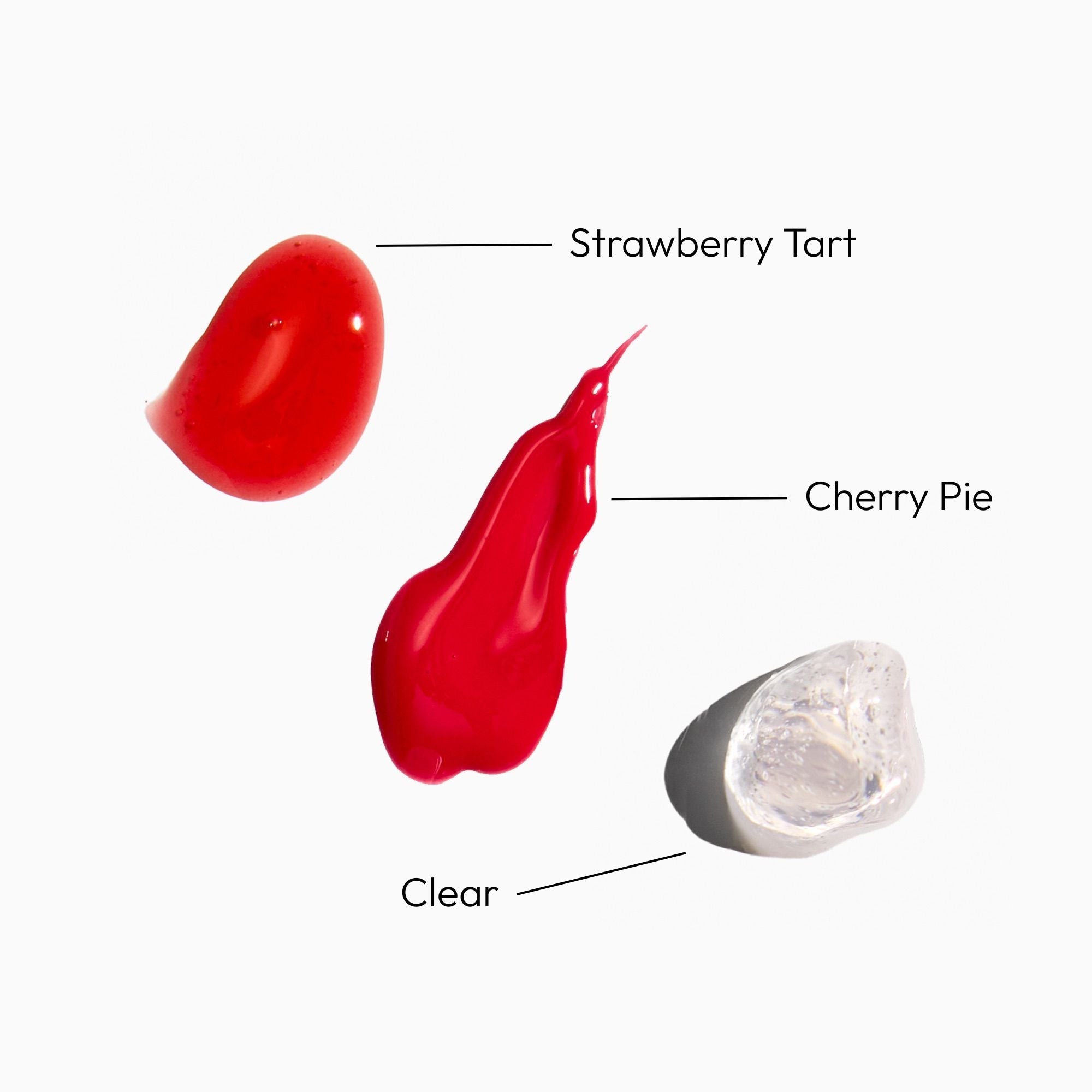 Three different colored lip gloss swatches labeled 'Strawberry Tart', 'Cherry Pie', and 'Clear' on a white background.