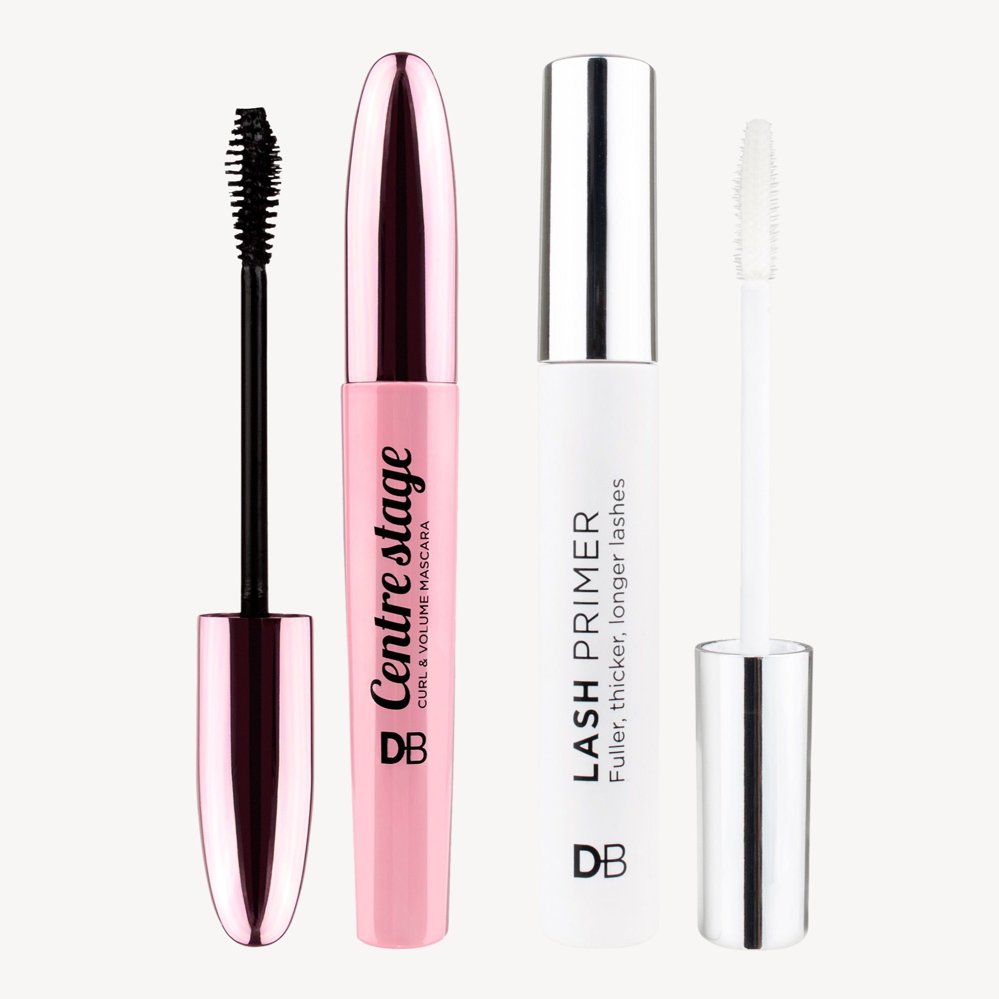 Pink and white mascara and lash primer set with shiny metallic lids. The set includes Centre Stage mascara and a lash primer by DB.