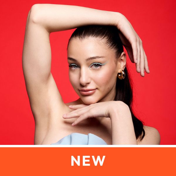 Woman with sleek hair poses against a red background, wearing gold hoop earrings. Her arms frame her face elegantly. Text reads "NEW" at the bottom.