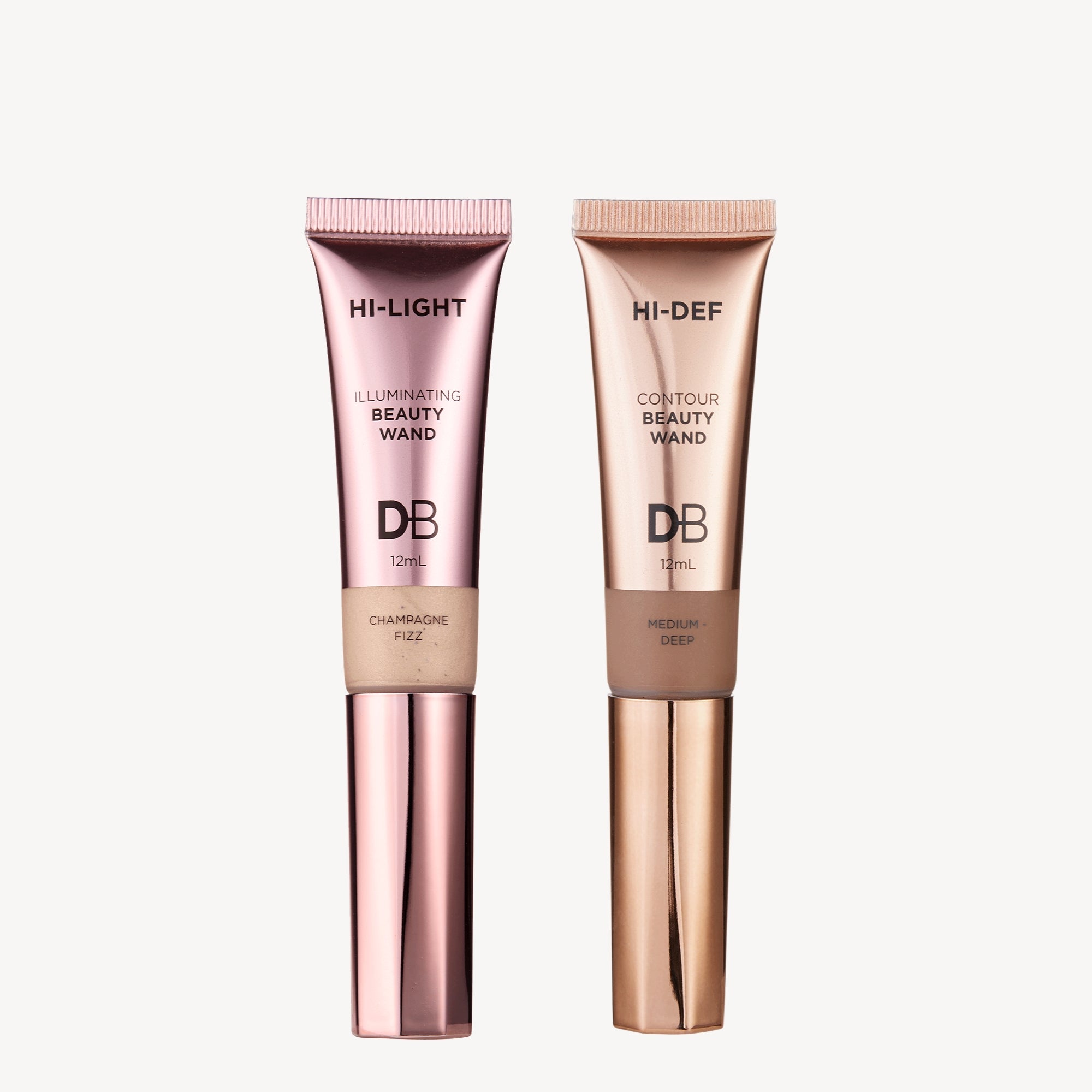 Two beauty wands on a white background: one pink for highlighting, labeled "Champagne Fizz," and one gold for contouring, labeled "Medium-Deep."