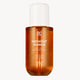 Bottle of 'Midnight Mango' hair and body fragrance mist on a white background