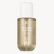 Gold bottle of 'On Sunny Beaches' fragrance mist on a white background
