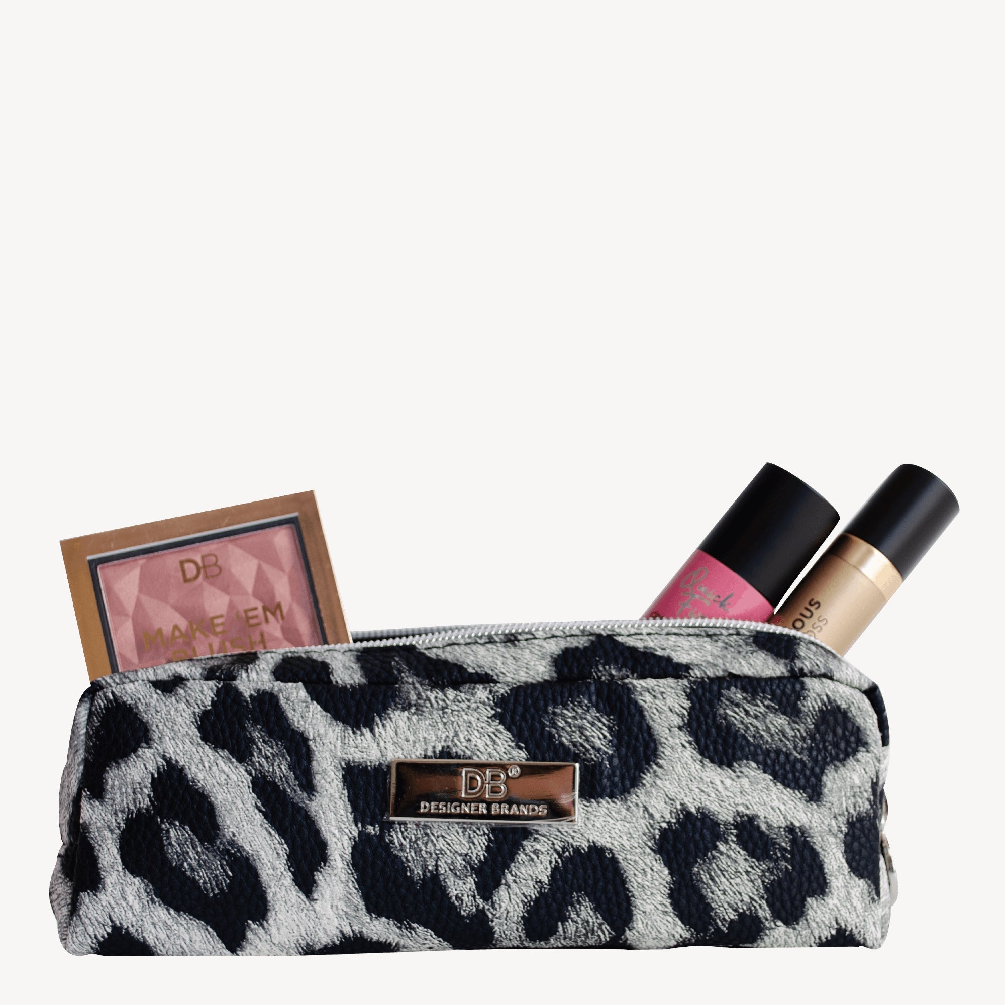 Leopard print makeup bag with blush, lipstick, and foundation. Features gold "DB Designer Brands" logo. Stylish cosmetics storage.