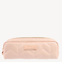 Quilted blush pink makeup bag with a zipper and embossed logo on a metal plate, perfect for luxury jewellery storage.